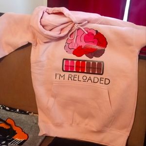 A true to size medium light pink hoodie with a custom  created design by me